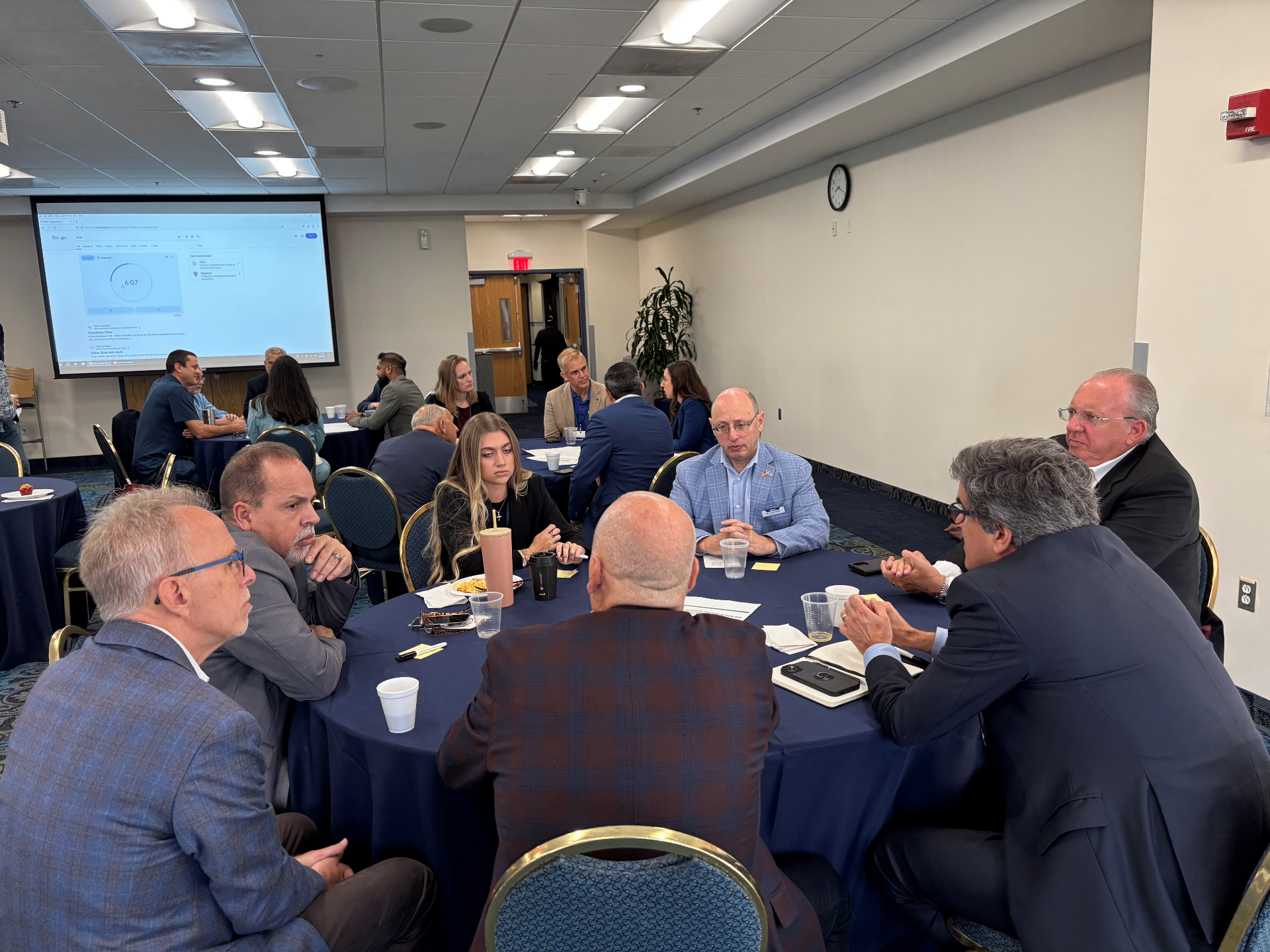 Senior executives in conversation at a Miami breakfast roundtable